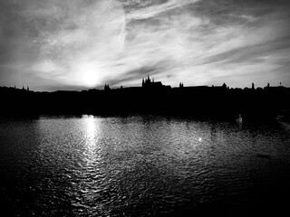 Sunset, reflection in the river. Monochrome. Prague, Czech Republic, Europe