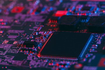 Fototapeta na wymiar Hardware technology concept in neon light. Motherboard in blue-red light. Computer component. Dark photo.Neon Colors.GPU processor. CPU