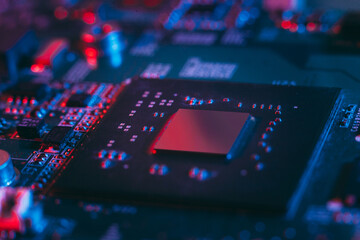 Fototapeta na wymiar Hardware technology concept in neon light. Motherboard in blue-red light. Computer component. Dark photo.Neon Colors.GPU processor. CPU