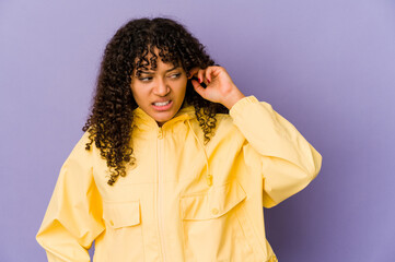 Young african american afro woman isolated covering ears with hands.