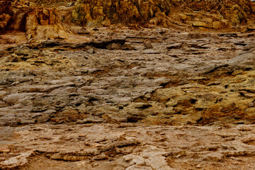 colored stones in a volcanic crater falling from the heat