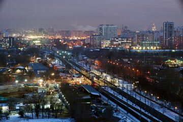Fototapeta premium Moscow, Russia. Desember 23 2020: Trains and the Moscow skyline. Ostankino railway platform.