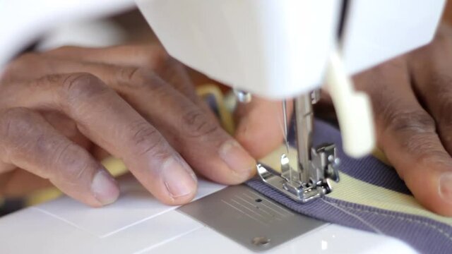 machinist making a face mask at home on a sewing machine stock video footage