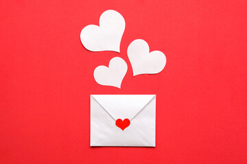 Letter valentine and white hearts on a red background