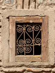 Vintage window with security rusty bars. Typical historic house in in North Africa.