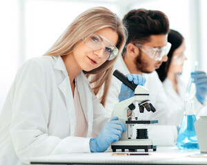 close up.female scientist working in a modern laboratory