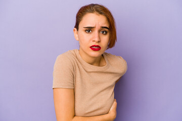Fototapeta premium Young arab mixed race woman having a liver pain, stomach ache.