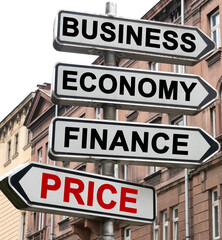 The road indicator on the arrows of which is written - business, economics, finance and PRICE