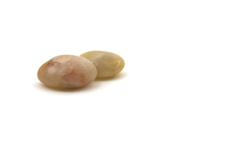 Two brown quartz stones on a white background