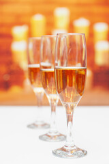 Three glasses of champagne, the first is in focus