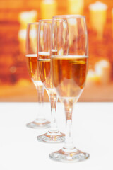 Three glasses of champagne, the second is in focus