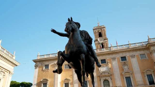Palazzo Senatorio and tracking equestrian statue of Marcus Aurelius at Michelangelo's square del Campidoglio in old historic city center of Rome, Italy