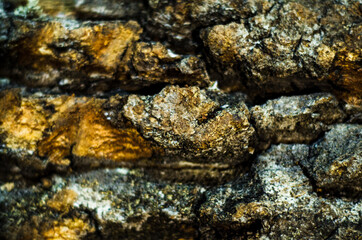 Black rock background with gold / yellow colored rocks