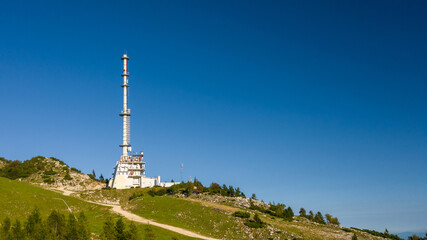 Fototapeta premium Mountaintop of Zvoh and Krvavec with telecommunication tower, Slovenia