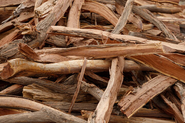 many pieces of wood stacked in a pile to form an interesting pattern