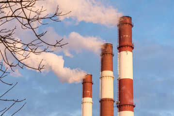 Thermal power plant pipes erupt smoke into the air. Vasileostrovskaya CHPP-7, a combined heat and...