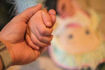 Father hold little child daughter hand,home family education love concept