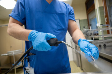in a sterilization department of the hospital, surgical instruments are pre-cleaned with steam