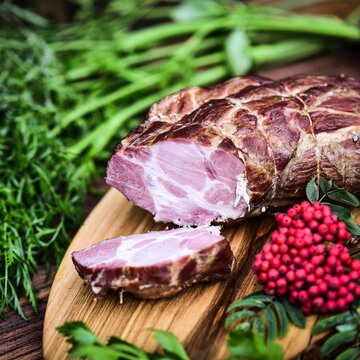 Traditional cold cuts served on wooden boards.