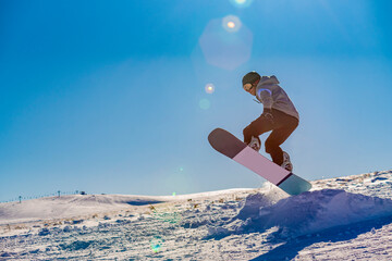 A snowboarder in the Erciyes ski field in Kayseri. blank text space