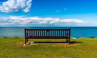 Fototapeta na wymiar Somewhere to sit and watch the sea and the tides in the Thames Estuary in summer