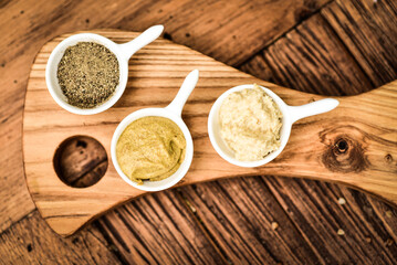 Herbs and spices on an ash serving board.