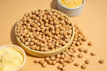 Chickpeas in small yellow ceramic plate bowl isolated on beige background.vegetarian dish. style minimalism. on bowl close up