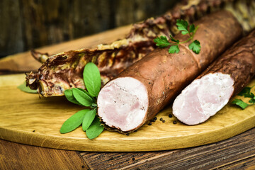 Traditional cold cuts served on wooden boards. - obrazy, fototapety, plakaty