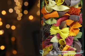 Different colored pasta in a glass, closeup