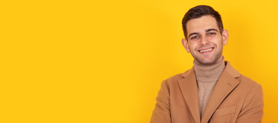 isolated portrait of young man in coat