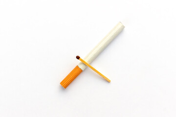Cigarette with wooden match isolated on white background