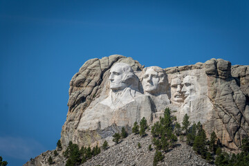 Fototapeta na wymiar The Carved Busts of George Washington, Thomas Jefferson, Theodore “Teddy” Roosevelt, and Abraham Lincoln at Mount Rushmore National Monument
