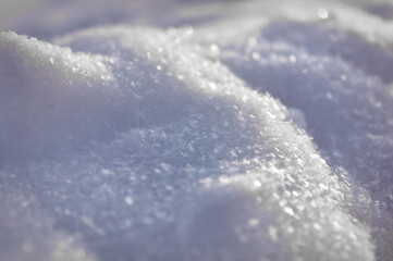 White fluffy snow texture. Snow textured surface background.