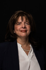 Brunette middle aged business women  headshot. 
