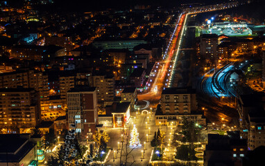 A city full of lights seen from the top of the hill