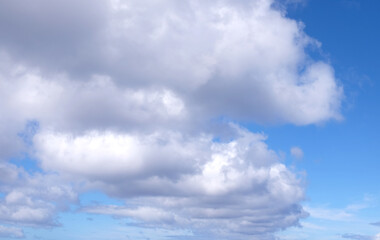 View from the coast of the Easter Island, of blue sky covered by white clouds, over the Pacific...