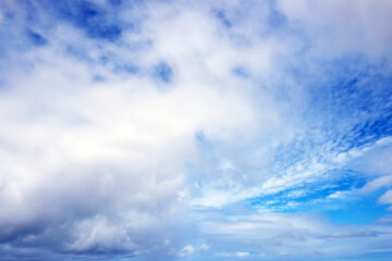 View from the coast of the Easter Island, of blue sky covered by white clouds, over the Pacific...