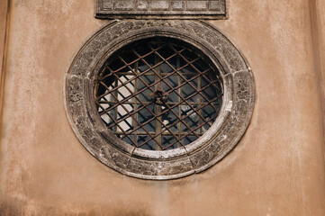 Bottom view of the wall of the Boim chapel in Lvov, Ukraine. Old Renaissance building with decorative porticos and round window.