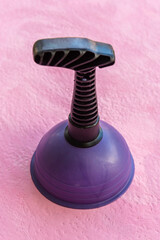 Rubber tool for cleaning clogged sewer pipes.