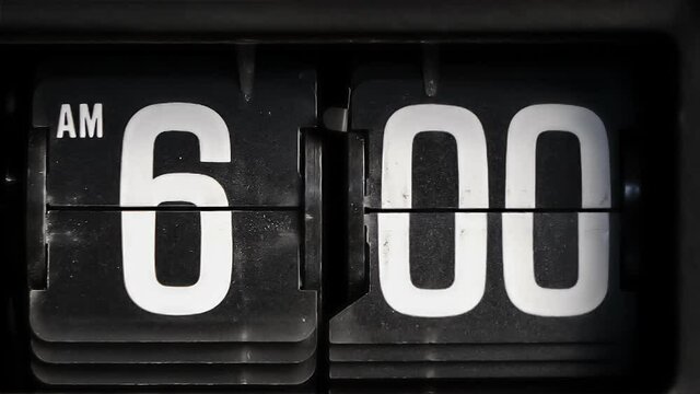 Retro flip clock changing from 5:59am to 6:00am in the morning