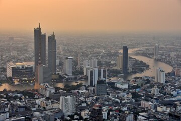 Aerial view of Bangkok cityscape at sunset, Thailand.