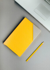 Yellow diary on a gray background