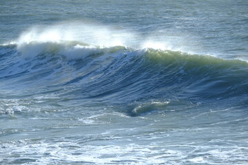 A big wave breaking in the small harbour of Batz sur mer. (West of France, december 2020)