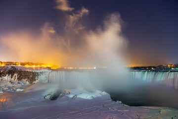 Vapour rises over Ontario's Niagara Falls after a wintery snowfall