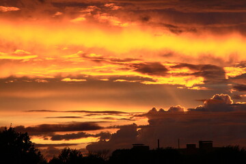 Red sky after a thunderstorm. Crimson yellow paints in the sky.