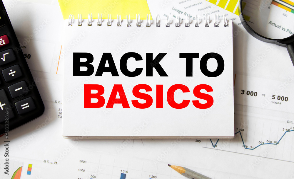Aufkleber business concept. notebook with text back to basic sheet of white paper for notes