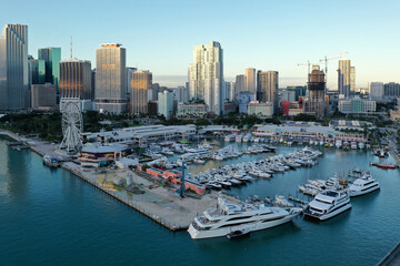 Fototapeta na wymiar Miami, Florida - December 27, 2020 - Aerial view of Bayside Marketplace, City of Miami Marina and Miami skyline on sunny winter morning.
