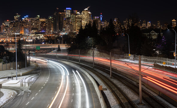 A downtown long exposure at night with traffic lights on Bow Trail Calgary Alberta Canada.