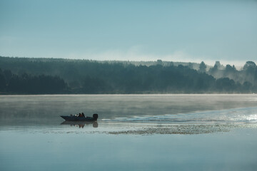 Obraz na płótnie Canvas Fog on the river and a boat.