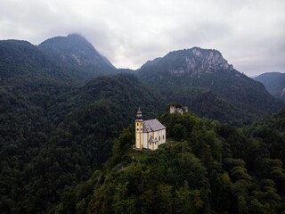 Isolated idyllic remote chapel church Sankt St Pankraz on rock hill Bad Reichenhall Berchtesgadener...